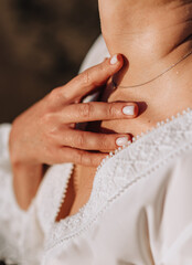 Young woman gently runs her wet hand over her neck after bathing. Photo, close-up portrait.
