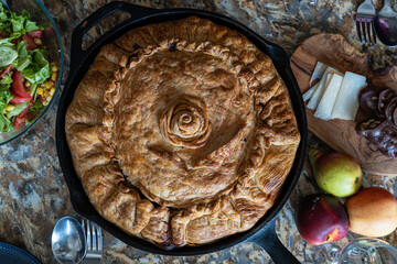 Tatar balesh pie, homemade traditional tatar cuisine, rustic potato meat pie, family home cooking, authentic ethnic food, traditional home party cuisine, view from above