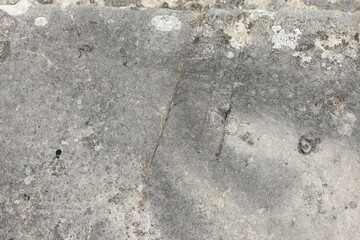 Grey old stone background. Weathered by time.