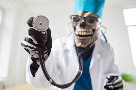 Close up portrait of the grim reaper in a doctor or nurse costume, holding a stethoscope in a hospital. This eerie medical and devilish elements, highlighting death in a medical setting.