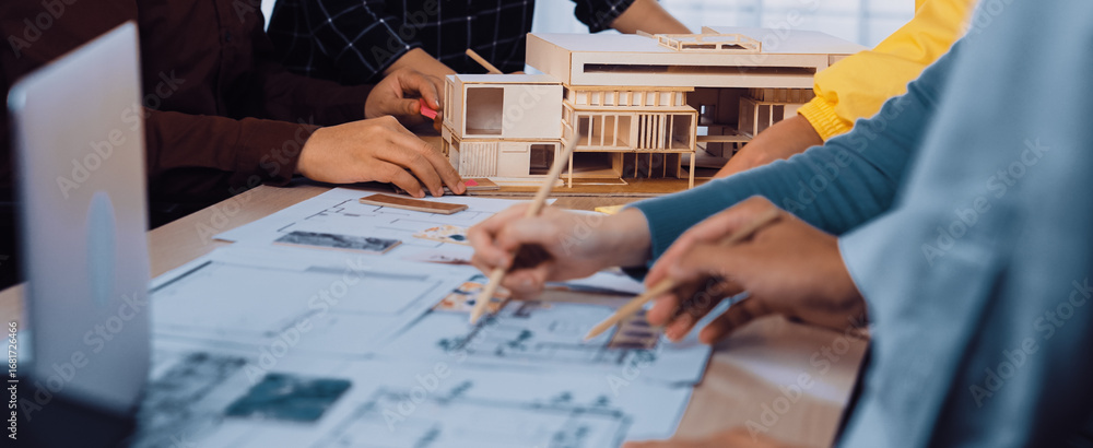 Poster a diverse team engages in brainstorming and planning an architectural project. the scene showcases h