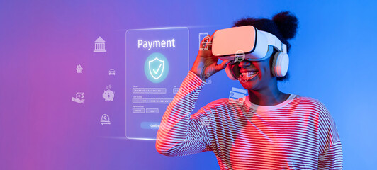A young woman explores a digital payment environment using a virtual reality headset, showcasing modern technology impact on online shopping and financial transactions. XDMCP