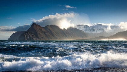 dramatic ocean waves crashing against a distant mountain range possible use stock photography for nature travel and art publications