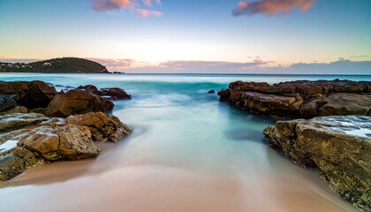 Peaceful sunrise over a tranquil beach cove