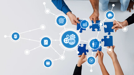 An engaging visual representing teamwork in a modern workspace, highlighting KPI and the collaborative effort of achieving business goals through strategic puzzle pieces. Amity