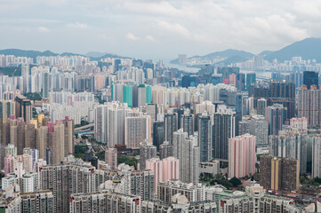Fototapeta premium View of Hong Kong and Kowloon from Lion Rock Head. Panorama of Hong Kong, skyscrapers and nature.