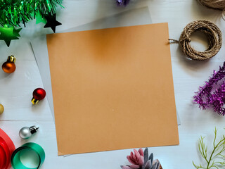 Christmas-themed decorations on a white wooden surface.