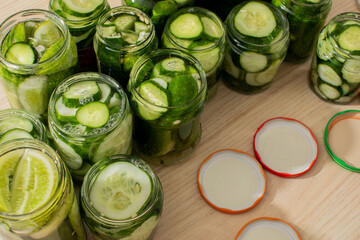 Jars brimming with tangy cucumber pickles, evoking folk preservation rituals and Cucamelon Fest,...