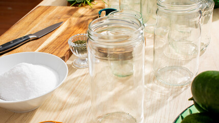 Preserving jars basking in sunlight evoke the charm of harvest season and quirky pickling rituals for Fermentation Fest