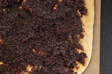 Raw poppy seed buns raw pastry dough baking sweet dessert tasty snack fresh delicious gourmet food background on the table rustic top view copy space