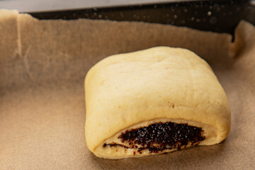 Raw poppy seed buns raw pastry dough baking sweet dessert tasty snack fresh delicious gourmet food background on the table rustic top view copy space