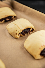 Raw poppy seed buns raw pastry dough baking sweet dessert tasty snack fresh delicious gourmet food background on the table rustic top view copy space