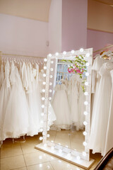 Wedding dress salon with decor. High quality photo of wedding background.