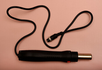 Black hair dryer soldering iron. Soldering iron for mounting radio elements.