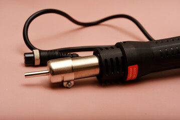 Black hair dryer soldering iron. Soldering iron for mounting radio elements.