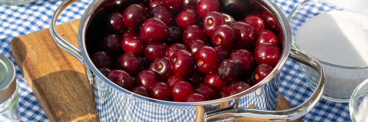 Shiny cherries dance in steel pot embracing summer solstice revelry, infused with a wink of vintage Appalachian cantatas
