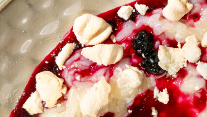 Rich berry-swirled meringue crumbles dance on velvety dessert canvas, perfect for eclectic Festivus...