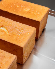 Golden cube bread bricks serenade senses, evoking Harvest Moon Festival and World Bread Day, a...