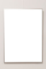 Obraz premium A blank canvas hangs on a clean, white wall in a minimalist art gallery. The simplicity encourages creativity and artistic exploration in this serene environment