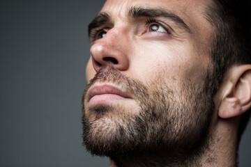 Obraz premium closeup of face exhibiting tension in neck muscles and forehead embodying fear from unexpected sound