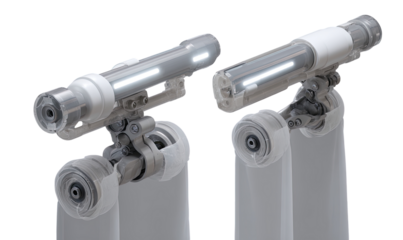 Two 3D renderings of a mechanical device, likely an engine or actuator,  depicting a component with internal glowing elements, mounted on supports.  Different perspectives showcasing inner workings