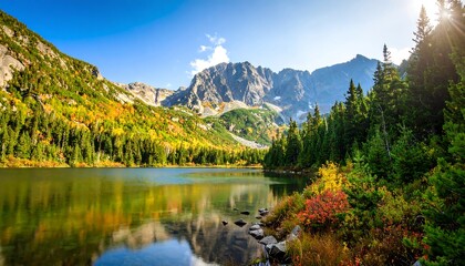 Fototapeta premium Picturesque mountain lake reflecting autumn foliage on a sunny day
