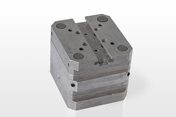 A detailed metal component is displayed prominently on a clean, white surface.