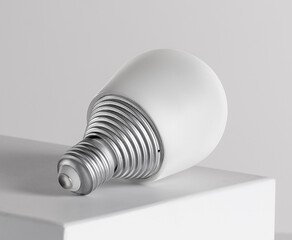 A light bulb with a sleek, contemporary shape lies on a smooth white surface, highlighting its minimalist aesthetics and suitability for modern interiors.