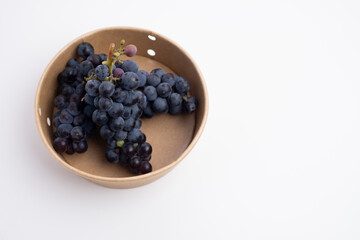 Fresh dark grapes on a light background. Concept of wine vitamins and health.