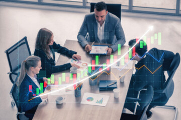 A diverse team collaborates in a modern office, analyzing financial graphs and strategies during a business meeting to drive growth and performance. Impute