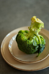 Broccoli on a plate, minimalist healthy food photo symbolizing vitamins, benefits of vegetables,...