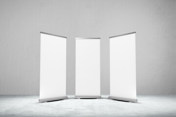 Empty three rollup banners stand. Blank template mockups. Exhibition stand 3 roll-up banners, screen for you design. Vertical white roll up for preview.