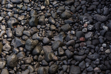 Black pebbles on a black beach on Lanzarote, Canary Islands, Spain, Europe