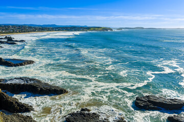 Drone aerial photograph of the rugged coastline in the Kiama suburb of Kiama Downs on the South Pacific Ocean coast in the Illawarra region on the south coast of New South Wales, Australia. 