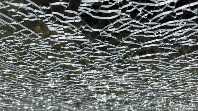 Cracked glass texture background. Broken tempered glass with cracks, shattered window pattern, chapped transparent surface wallpaper, safety shards mockup