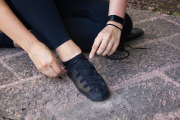 Lacing laces shoes for Irish dance on the floor