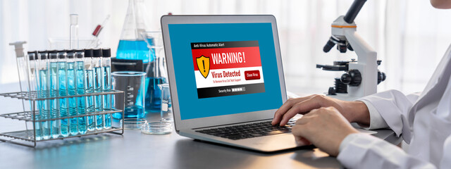 Virus warning alert on computer screen detected brisk cyber threat , hacker, computer virus and...