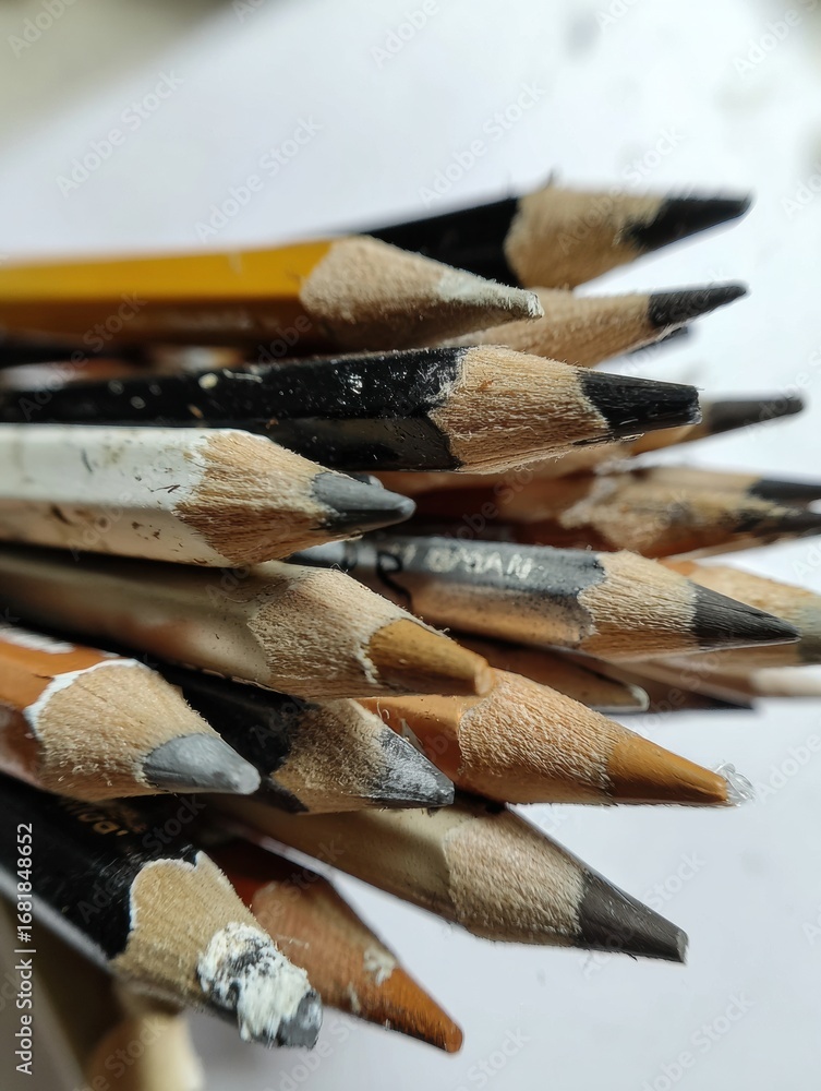 Poster a cluster of colored pencils in different shades is gathered together, displaying their sharpened ti