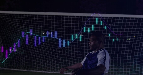 Posing soccer player wearing gear on pitch before goal net with neon candlestick chart, copy space