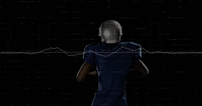 Holding football, player in blue jersey and helmet in studio with waveform and digital scan lines - Powered by Adobe