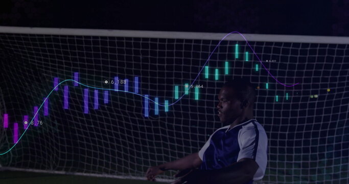 Posing soccer player wearing gear on pitch before goal net with neon candlestick chart, copy space