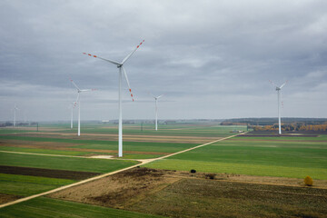 Drone photo of wind turbines on a field in Lodz Province, Poland