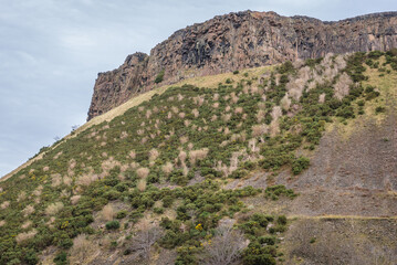 View on the Salisbury Crags in Holyrood Park also called Kings or Queens Park in Edinburgh city, Scotland, UK