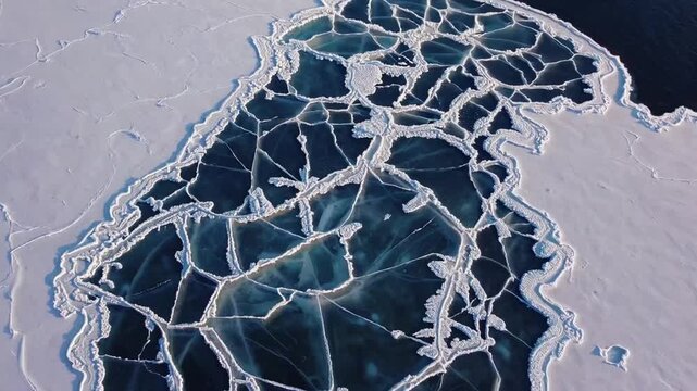 The textural pattern of frozen lake and its icy cover graphed from significant elevation using drone