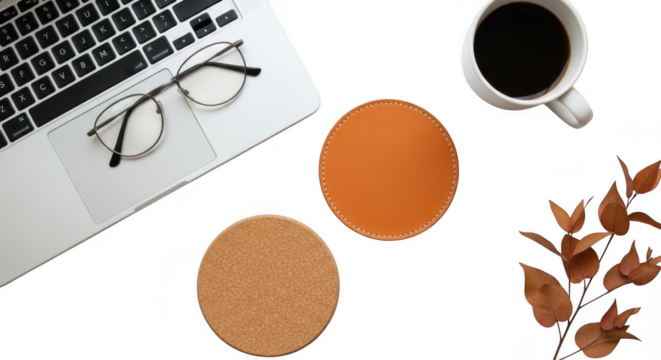 A laptop with glasses, a cup of coffee, and coasters on a transparent background