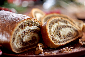Walnut roll on a wooden background. Croatian orehnjaca