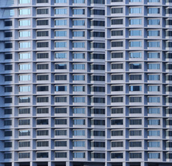 Naklejka premium Big tall building background with windows and glass.