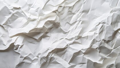 Obraz premium The image shows a close-up view of crumpled white paper, showcasing its texture and creases in detail.