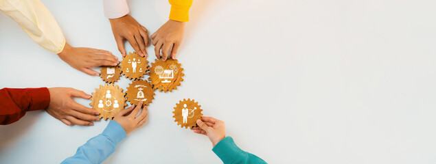 A vibrant assembly of diverse hands working together to connect puzzle pieces symbolizing business...