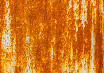 Heavily rusted metal texture. Deep orange and brown rust contrasts with remnants of light blue or...